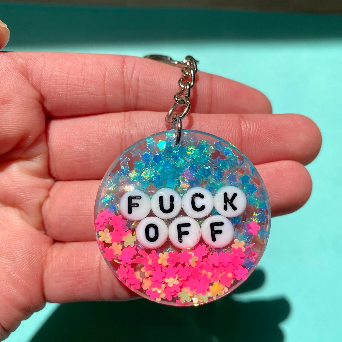 "Fuck Off" teal and hot pink glitter keychain with silver key ring